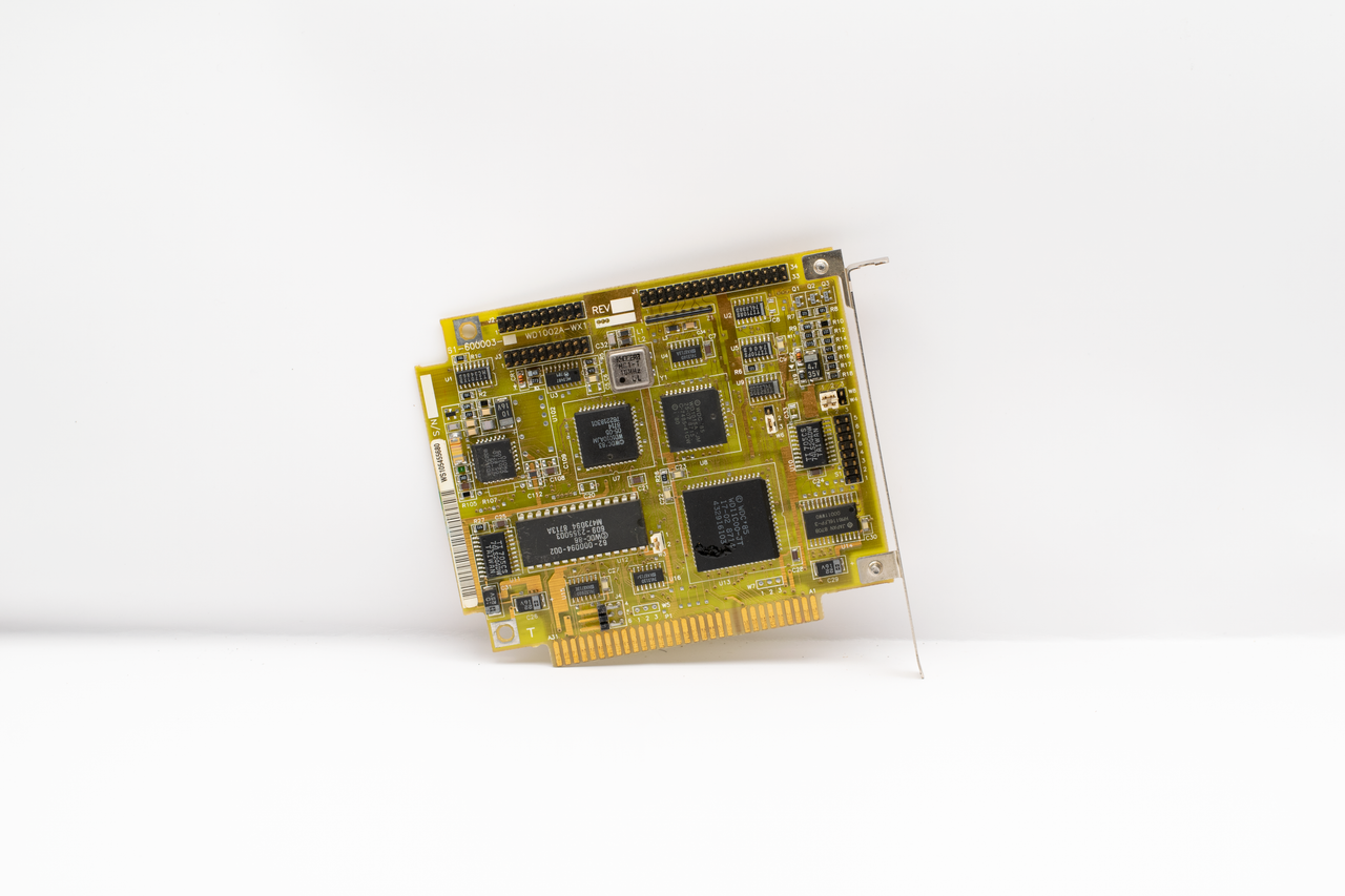 Antique circuit board showcasing vintage computing technology, isolated on a white background.